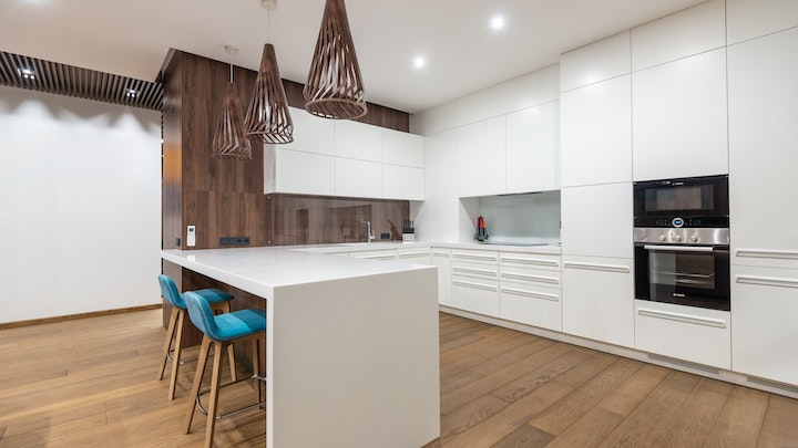 large kitchen with white furniture