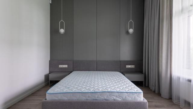 two ceiling lights above the bedside tables