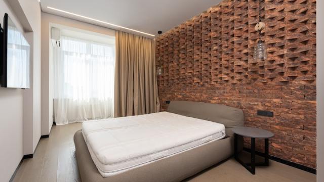 exposed brick wall in bedroom