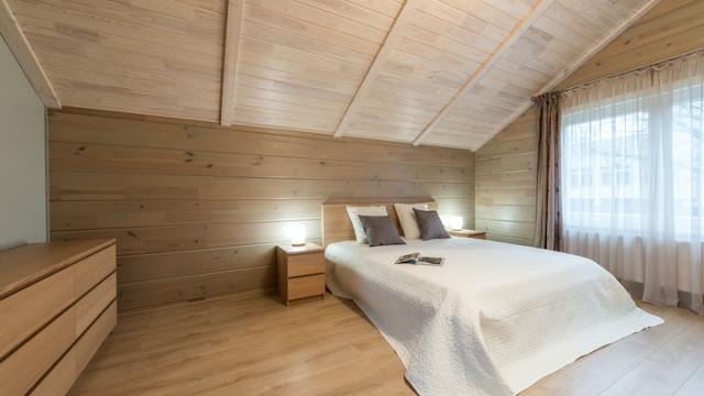 room with wooden walls and ceiling