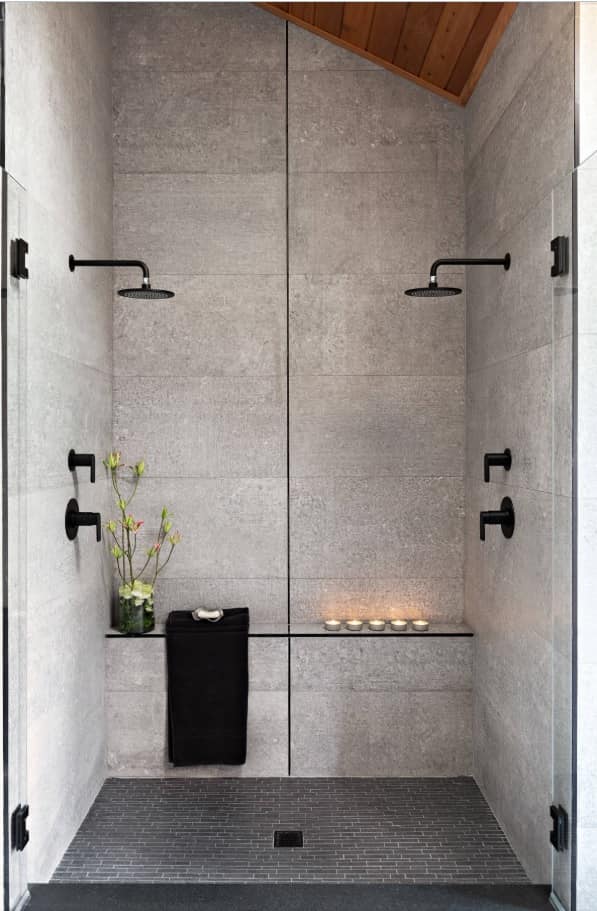 Faux concrete tiles for modern bathroom with black shower heads and plumbing accessories