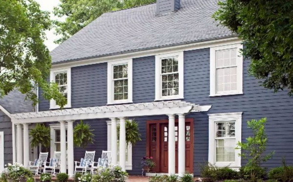 dark blue exterior house with white windows