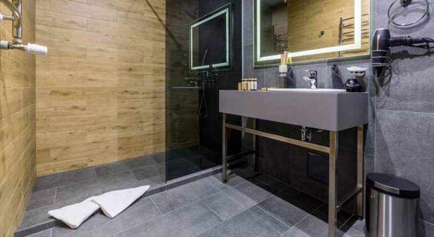 gray bathroom with wood