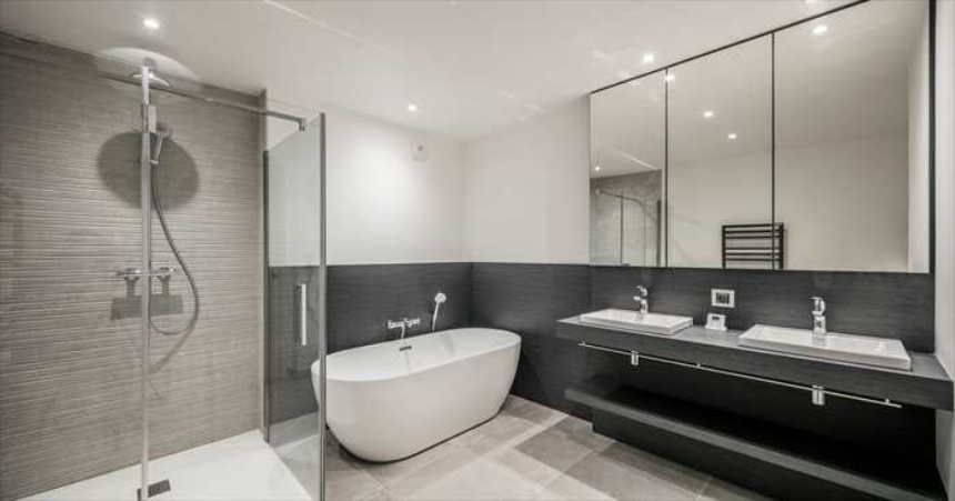 white bathroom with black skirting boards