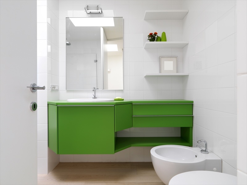 white bathroom with green furniture