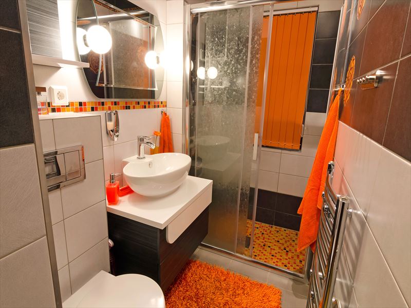 white bathroom with orange blinds