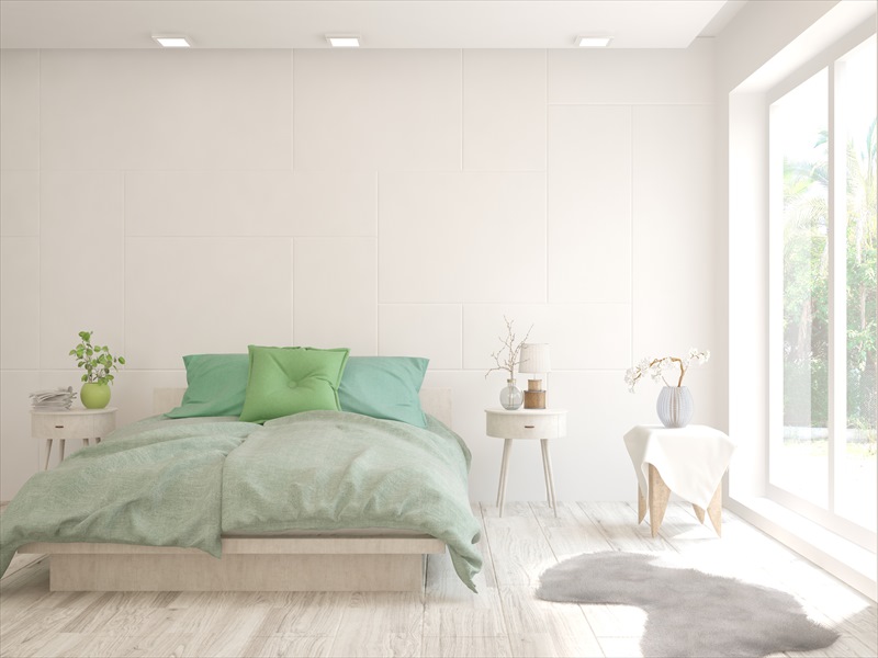 white room with green linens