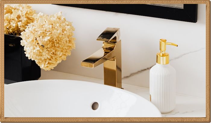 gold faucet in bathroom