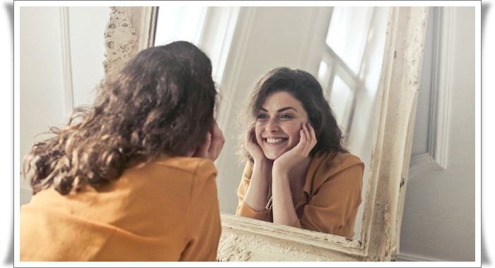 girl looking in the mirror