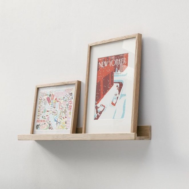 This natural oak shelf is specially designed to store picture frames without having to hang them on the wall.