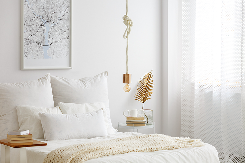 double bedroom with white and light linens