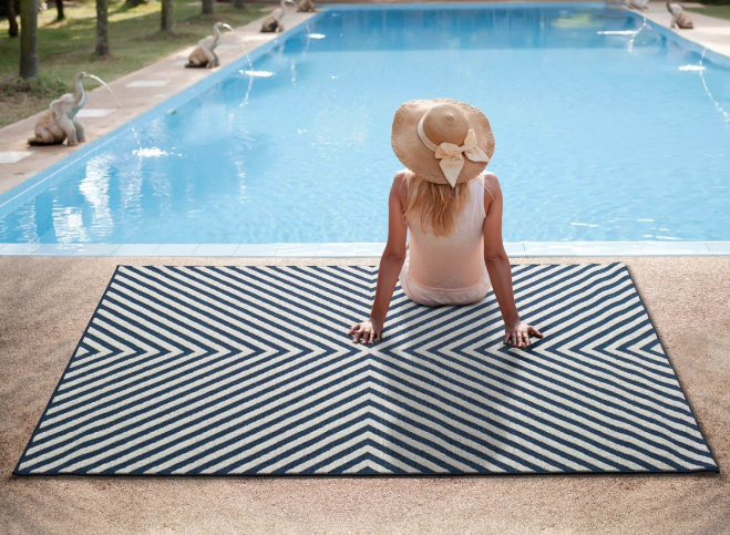 woman sunbathing by the pool