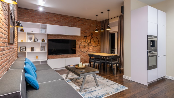 living room with brick walls