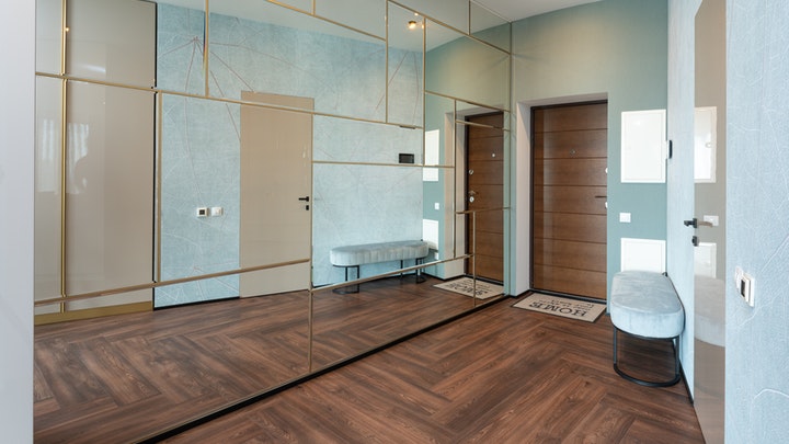 living room with large mirror on the wall