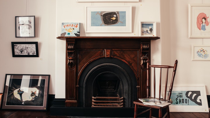 fireplace with several pictures