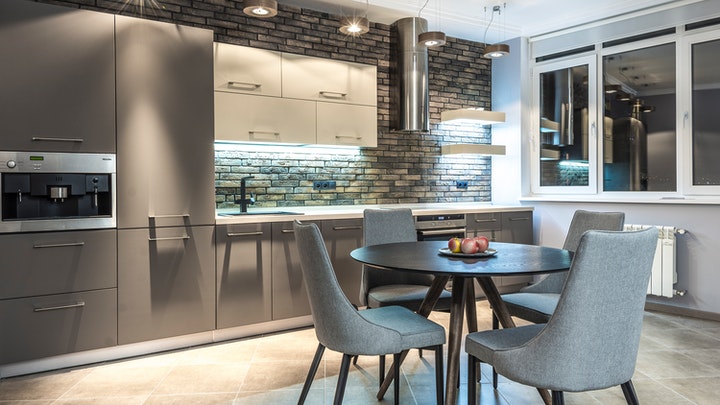 kitchen with exposed brick walls