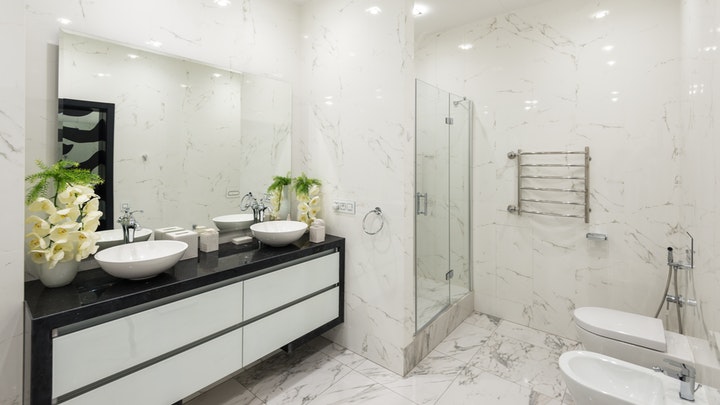 bathroom with double sink and flowers