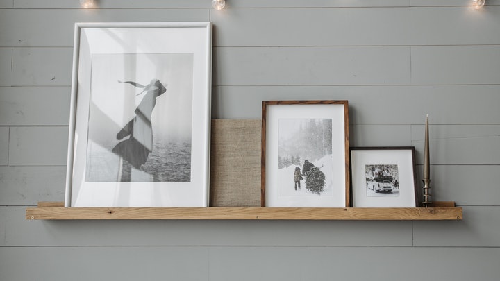 pictures on wooden shelf