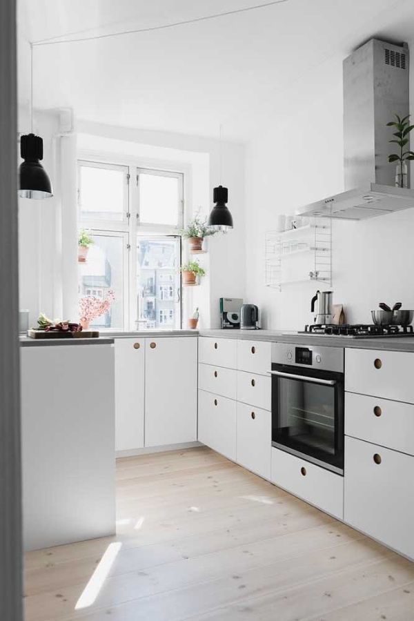 U-shaped white kitchen with black accents