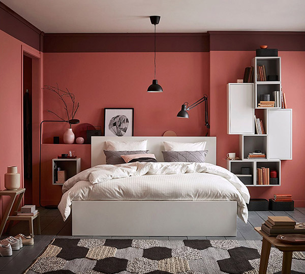 Cheerful and beautiful double bedroom in coral color