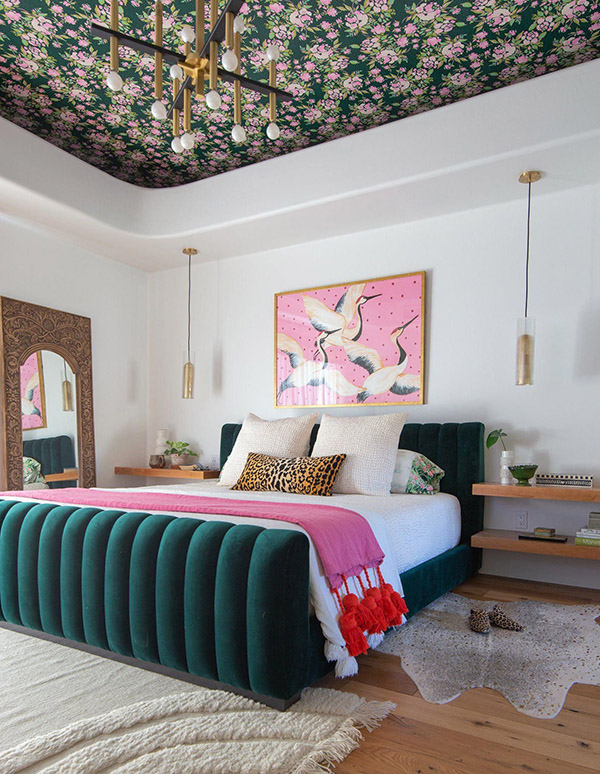 Cheerful and beautiful double bedroom with green and pink wallpaper