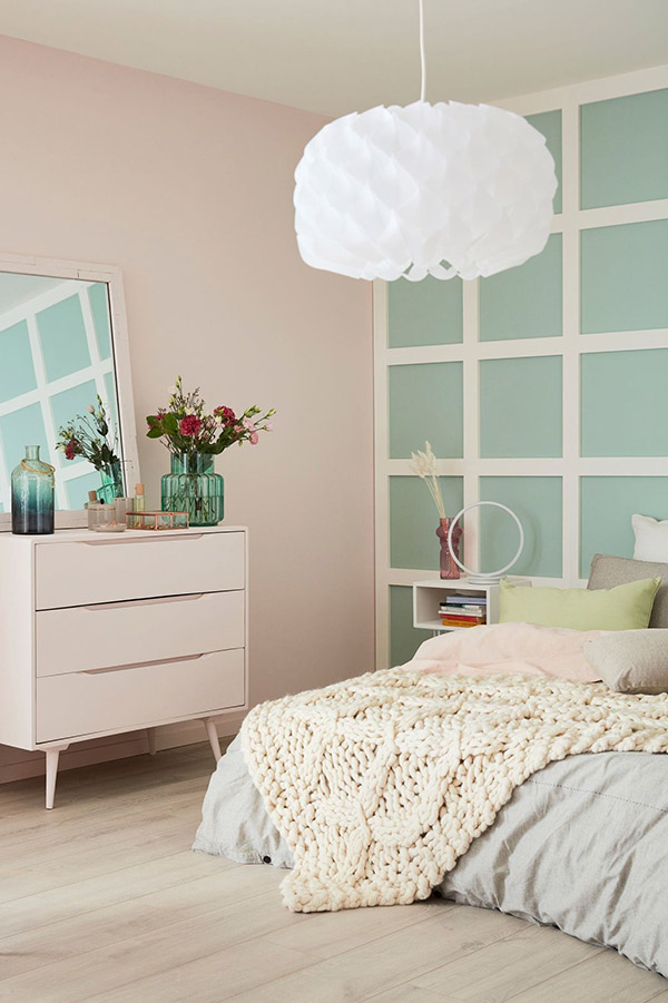 Cheerful and beautiful marriage room painted in pale pink and sea green