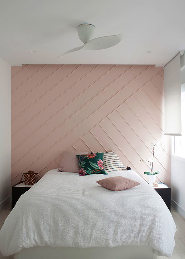 Beautiful and cheerful double bedroom in pale pink