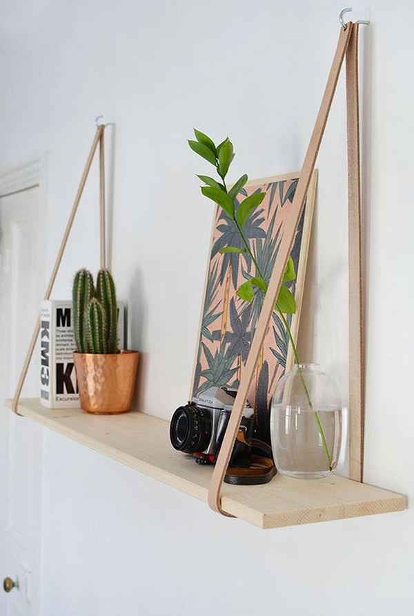 DIY bookcase made of leather and wood