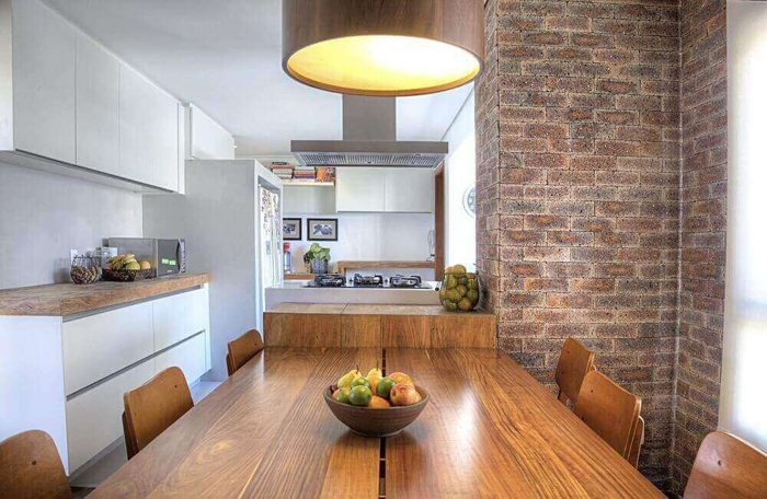 minimalist kitchen with wood and brick flooring