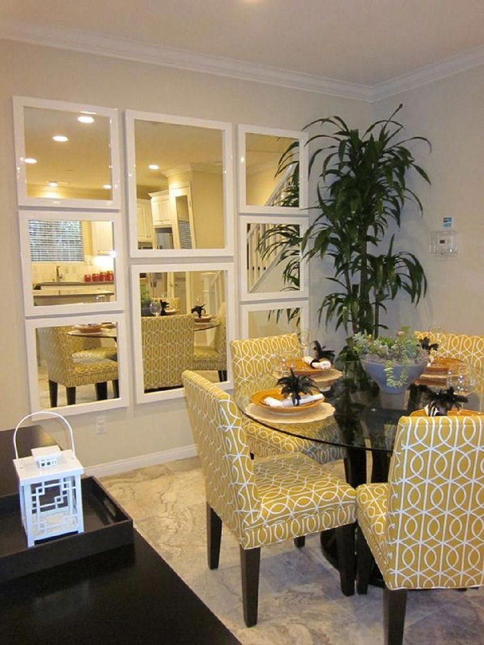 Dining room with walls decorated with mirror mosaic