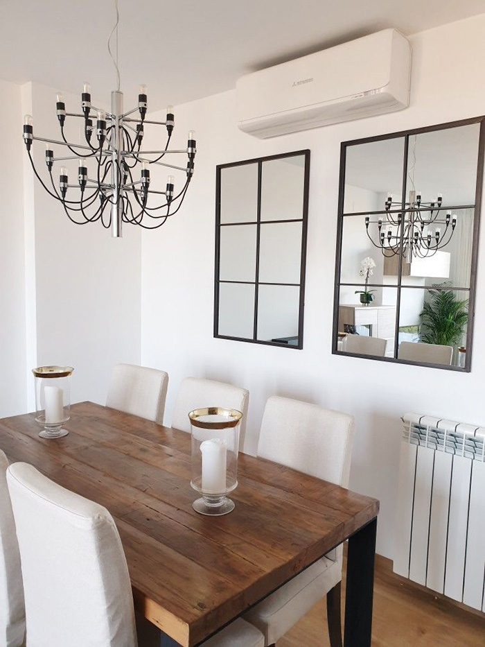 Dining room with two mirrored walls