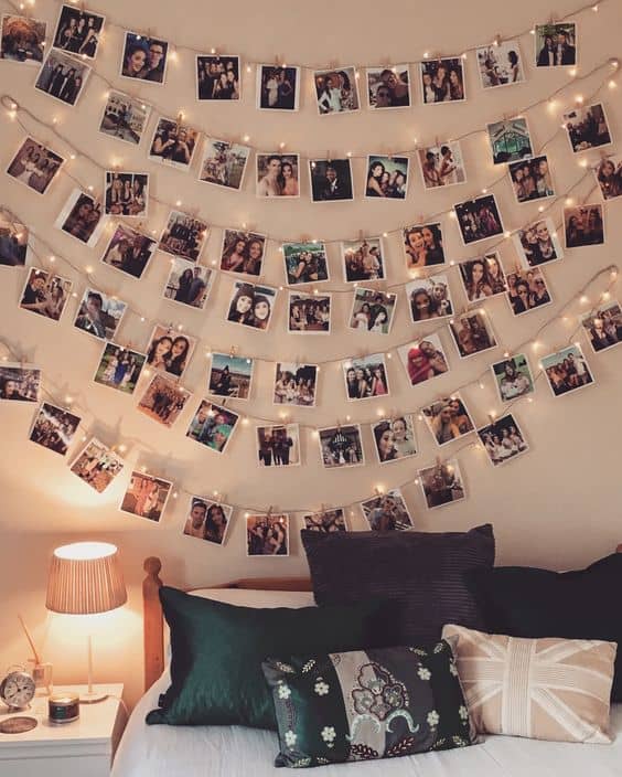 Hang your photos with lights to add atmosphere