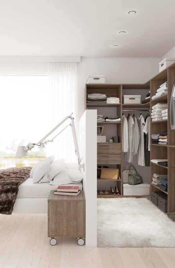 Build a dressing room behind the bed