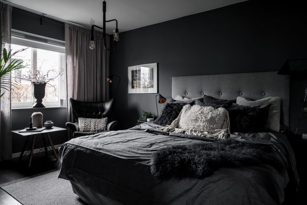 Decorating Ideas for Dark Bedroom Walls. Black walls and bedding in a modern style room with a quilted headboard