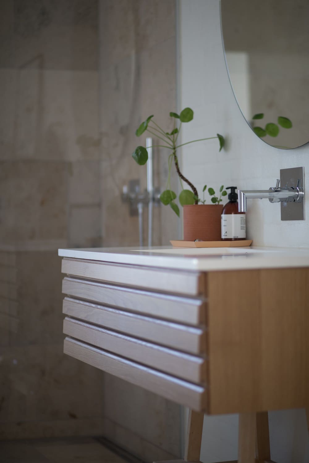 5 Reasons Why Wooden Cabinets Are Best for Your Bathroom. Vanity and plant to decorate small space