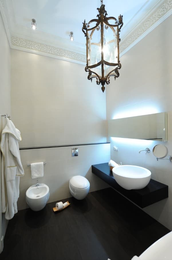 The Perfect, Eco-Friendly Bathroom Should Always Have a Bidet Small space with LED backlighting and white tiled walls