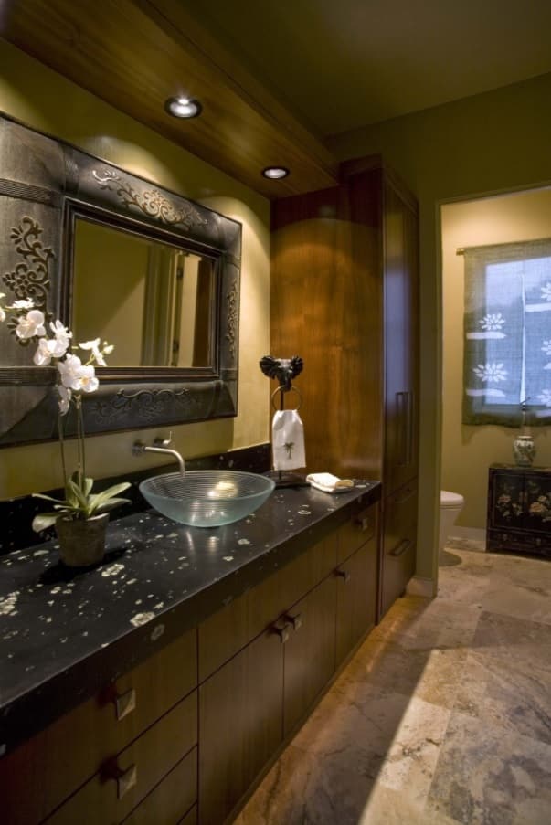 5 Ways to Enhance Your Bathroom. Cool dark scheme with marble and wood along with glass shell sink