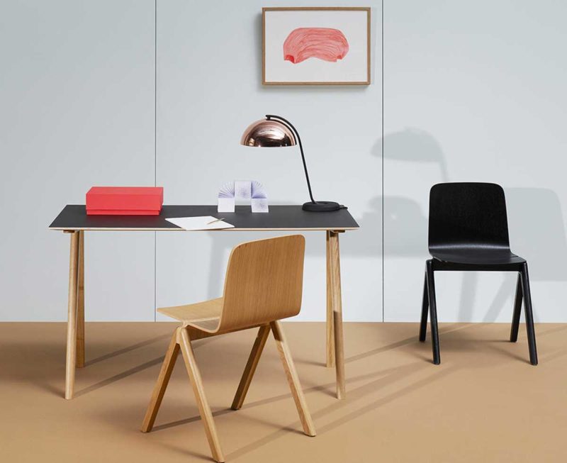 Table with black top and wooden legs