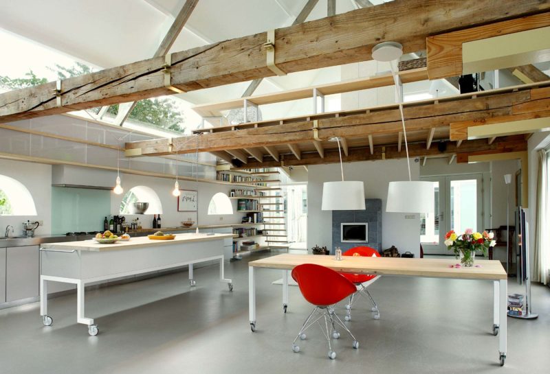 Barn converted into loft with wooden beams