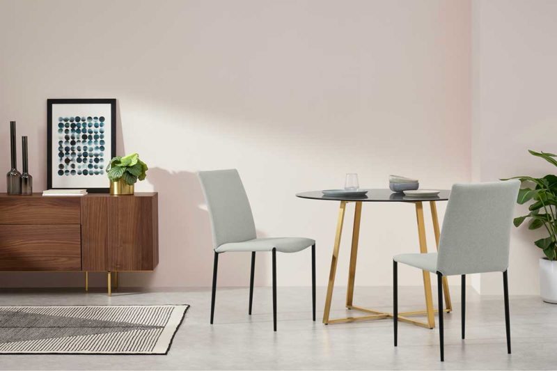 Dining room with gray fabric chair and black legs