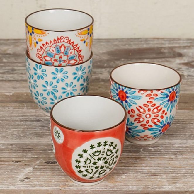 This set of 4 ceramic coffee cups features ethnic-inspired patterns.