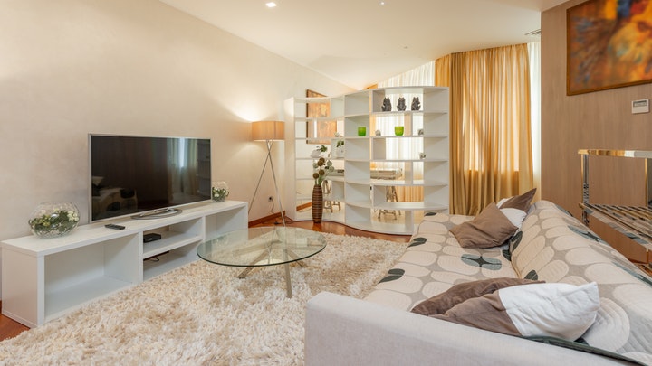 living room with carpet and curtains