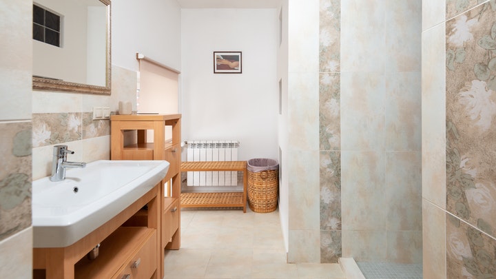 bathroom with wooden furniture