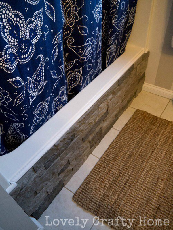 Bathtub decorated with faux stone panels 