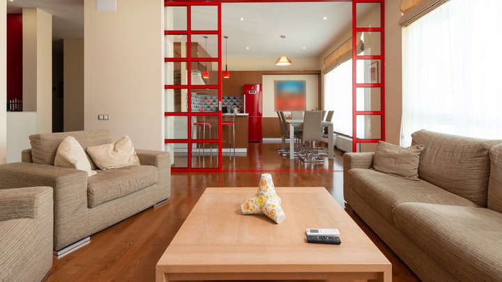 living room with red door