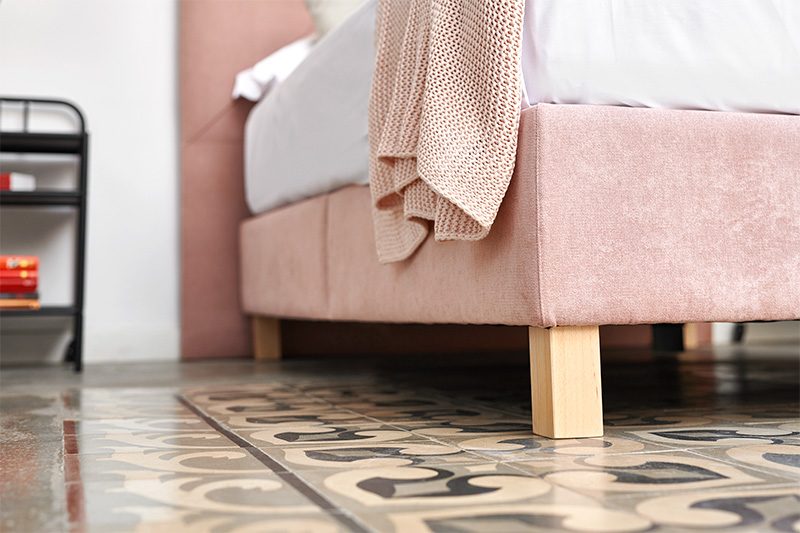 Folding pink upholstered cabana with wooden legs with Max Mattress