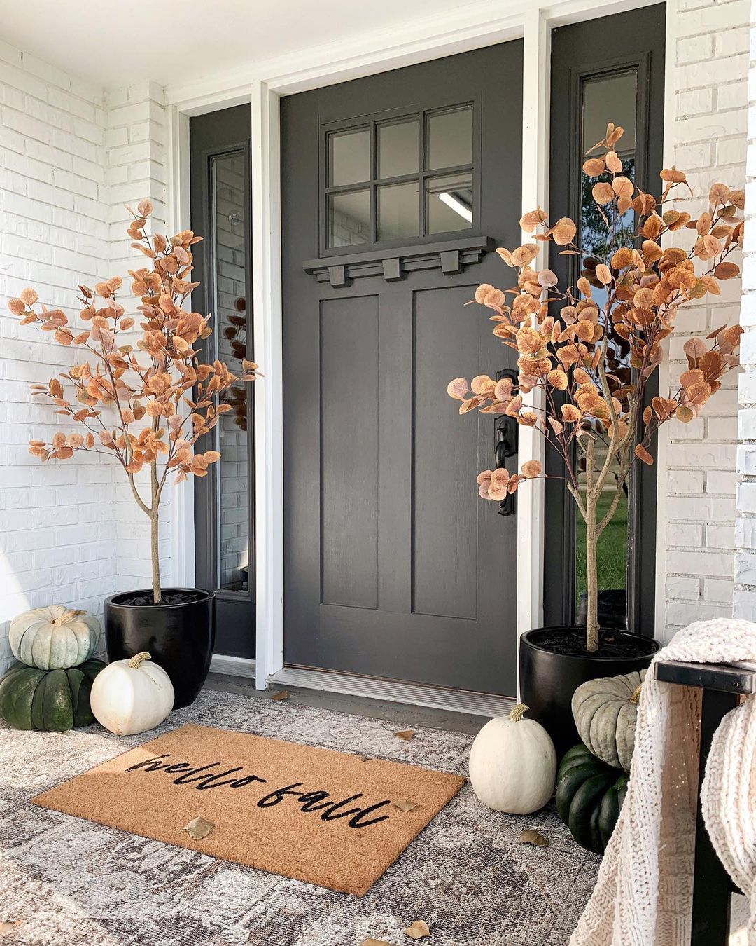 front doors with pumpkins