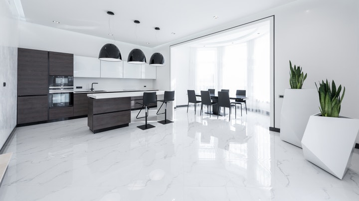 black and white kitchen with island and table