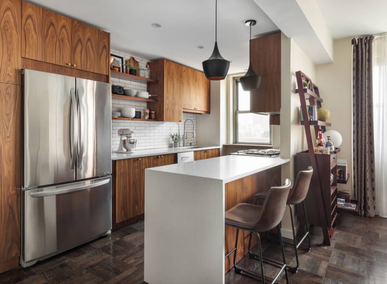 Why Are Kitchen Cabinets So Expensive? Awesome modern designed kitchen with hanging cabinets and steel double sided refrigerator