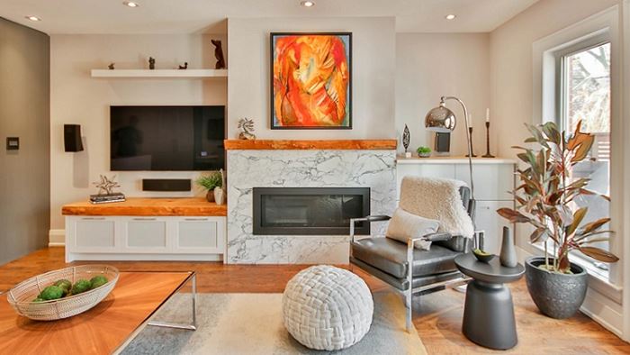 living room with large windows and fireplace